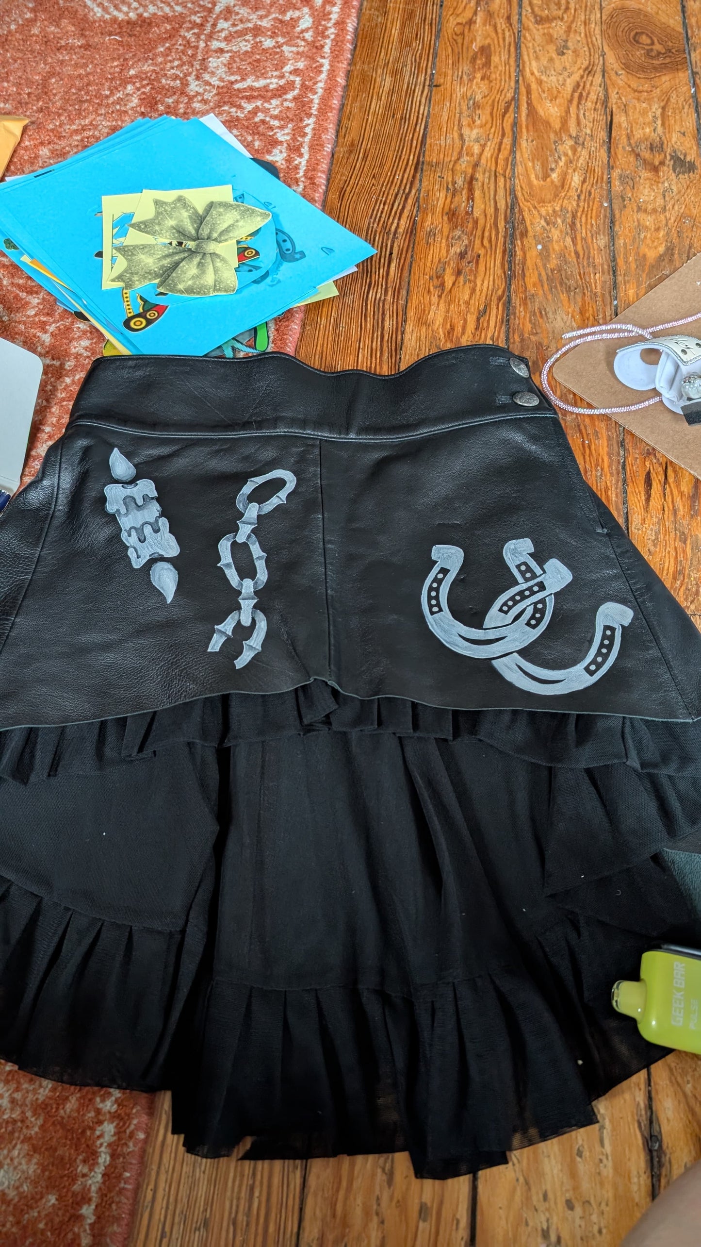 Black leather skirt with hand-painted tattoo art