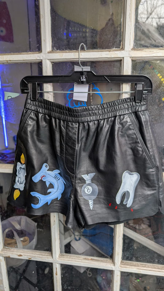 Hand-painted leather shorts with tattoo-inspired artwork